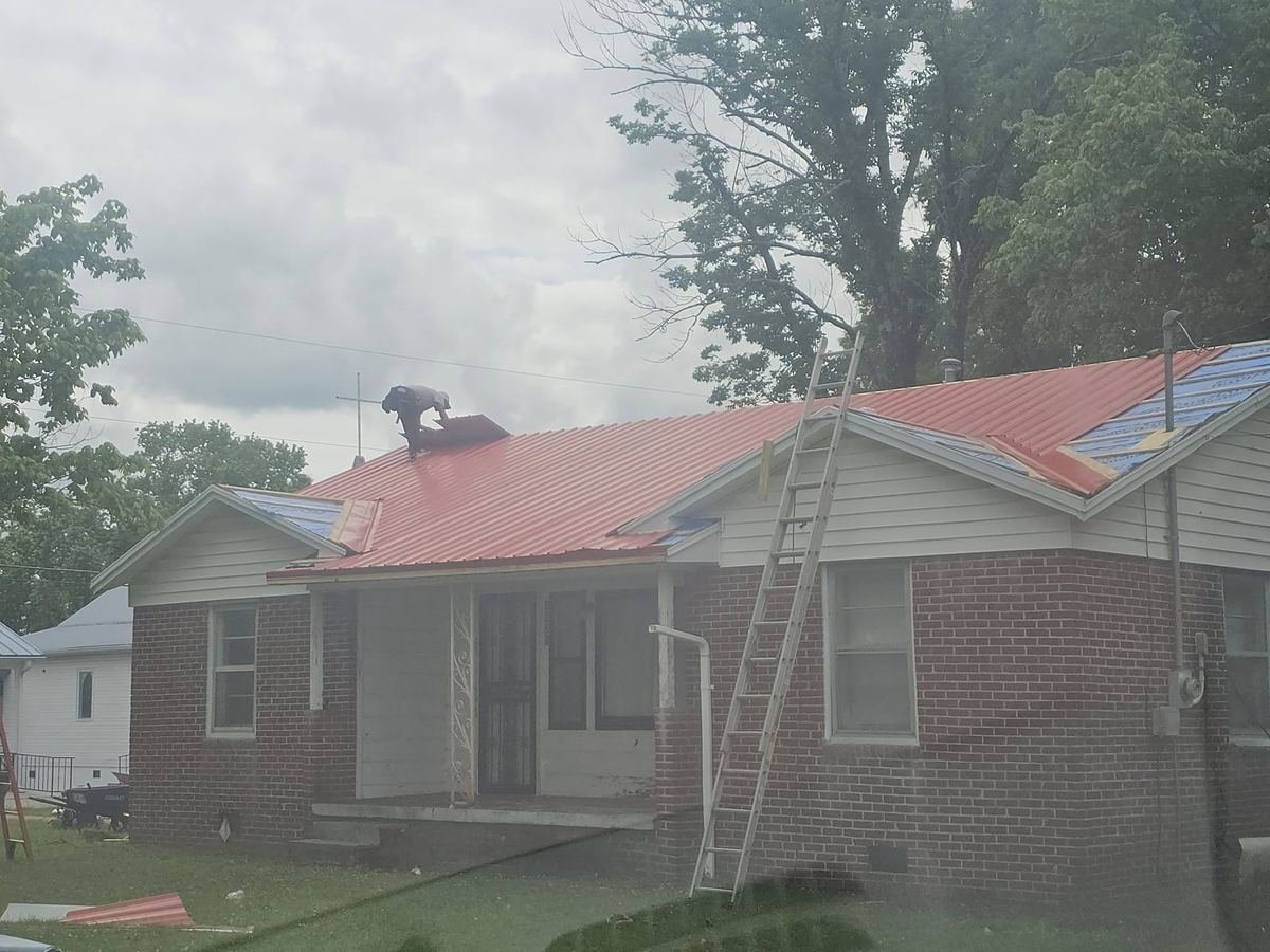 Metal roof installation in progress by Crawford Residential and Industrial Repair.