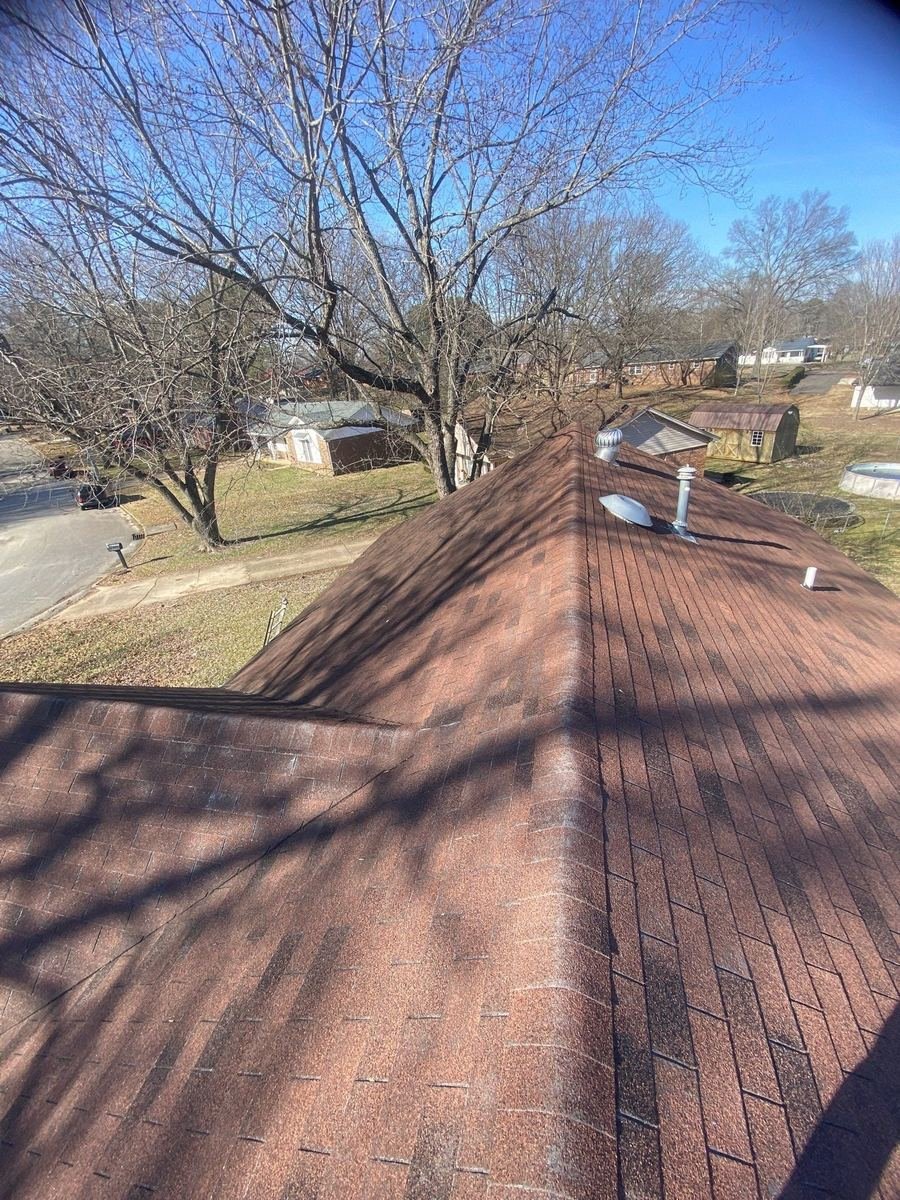 Crawford team member conducting a detailed roof inspection.