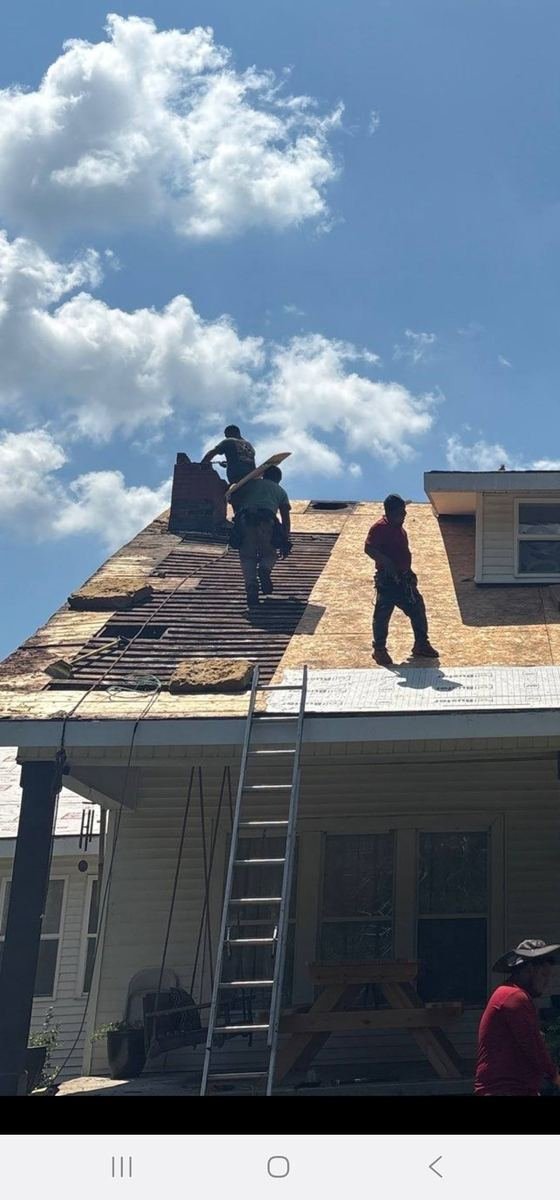 Crawford roofing crew performing maintenance on a residential roof.