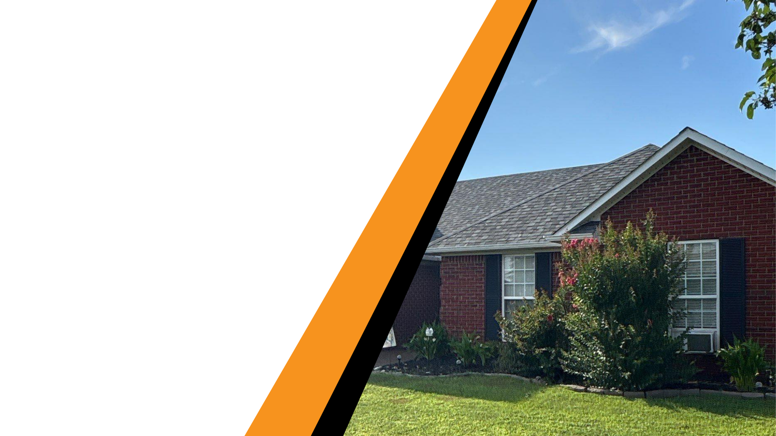 Roof replacement completed on red brick home with black shutters in Jackson, TN.